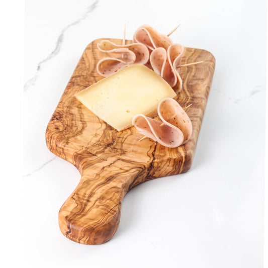 Olive wood cutting board with cheese and meat slices