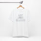 Just Vibes Graphic T-Shirt in white with minimalist floral design hanging on a wooden hanger against a white background.