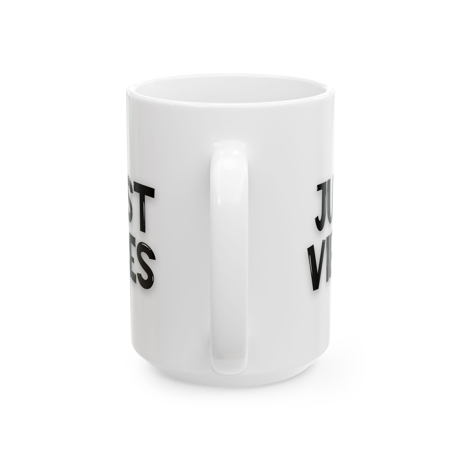 Back view of a white ceramic mug with a sturdy handle, partially displaying the 'Just Vibes' text in bold black font.