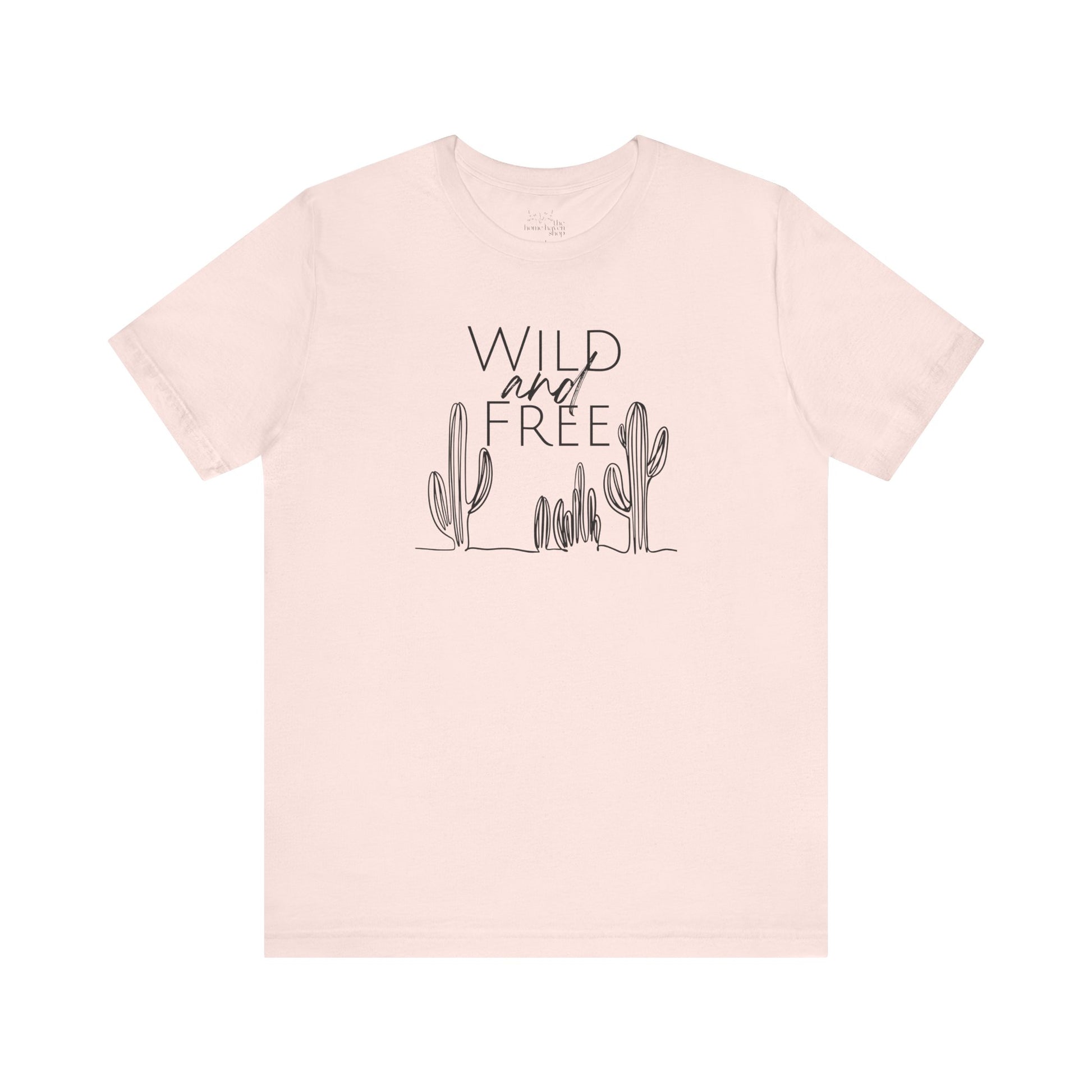 Light pink Wild and Free cactus graphic T-shirt laid flat, offering a soft and trendy option for boho-inspired wardrobes.