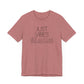 Just Vibes Graphic T-Shirt in dusty rose with minimalist floral design laid flat against a plain white background.