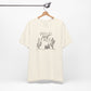 Cream Wild and Free cactus graphic T-shirt on a hanger, showcasing a minimalist desert-inspired design for casual and boho styles.