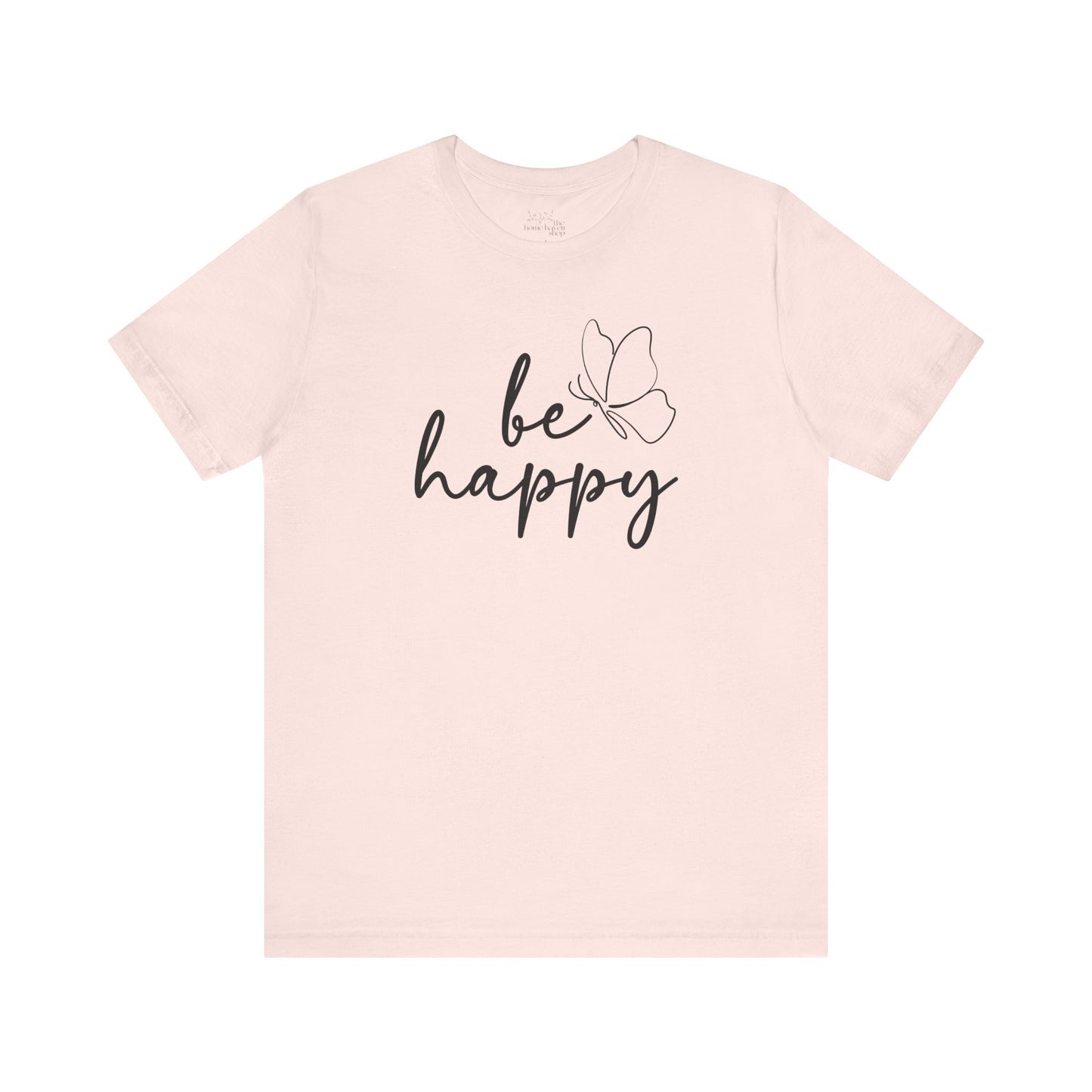 Soft pink Be Happy graphic t-shirt with minimalist butterfly design, perfect for casual wear and motivational style.