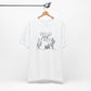White Wild and Free cactus graphic T-shirt on a hanger, featuring a clean and minimalist design for boho and casual outfits.