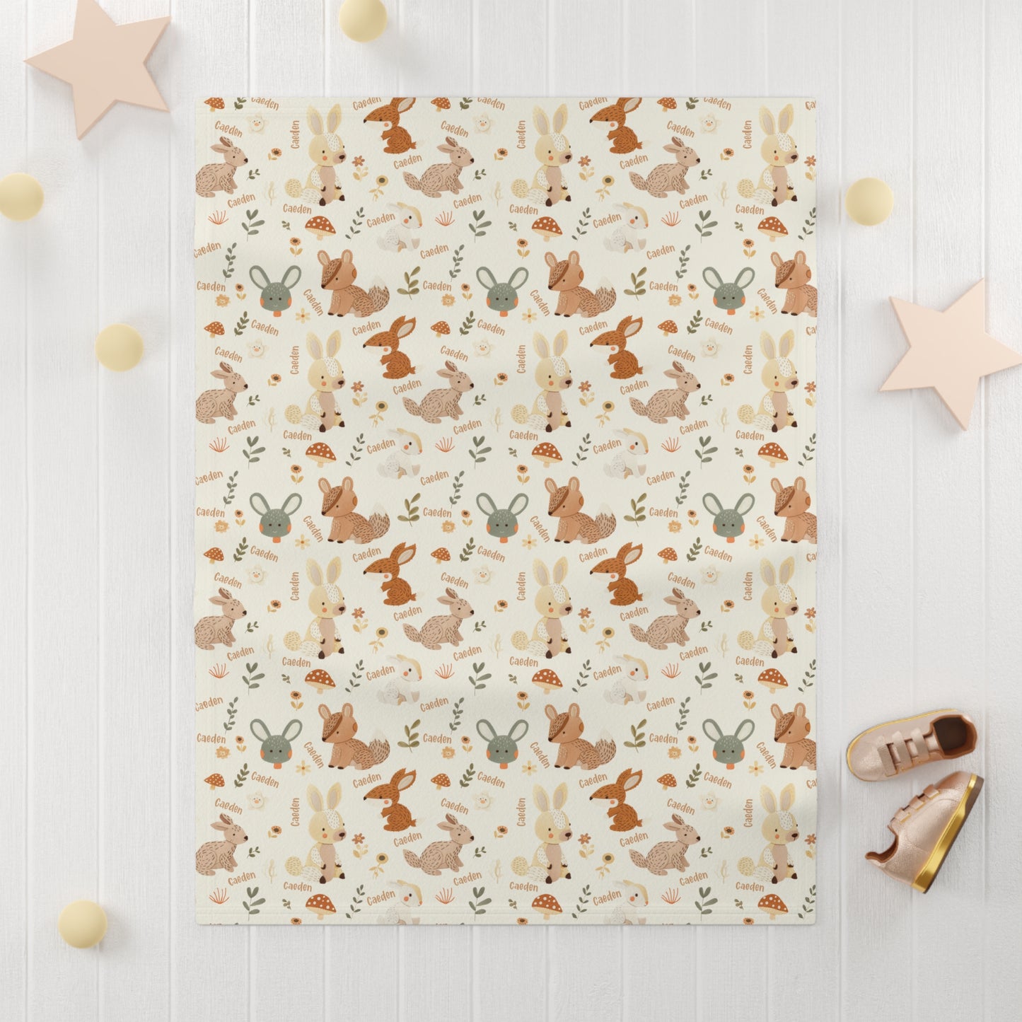 Personalized woodland animals baby blanket on floor