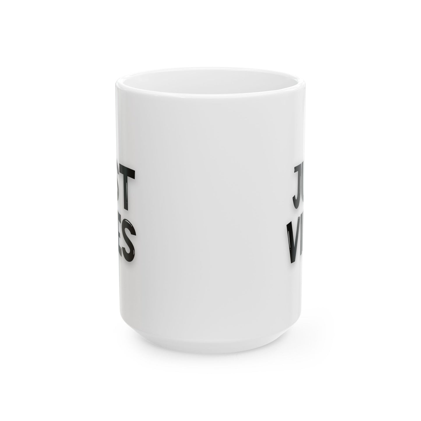 Side view of a white ceramic 15oz mug with partial 'Just Vibes' text in black, showcasing its sleek and durable design.