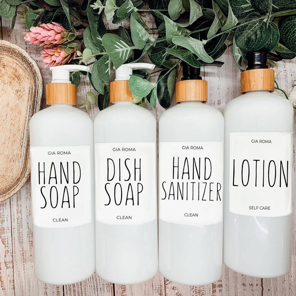 Set of 16oz white PET pump bottles labeled hand soap, dish soap, hand sanitizer, and lotion. Stylish dispensers with floral and greenery decor.