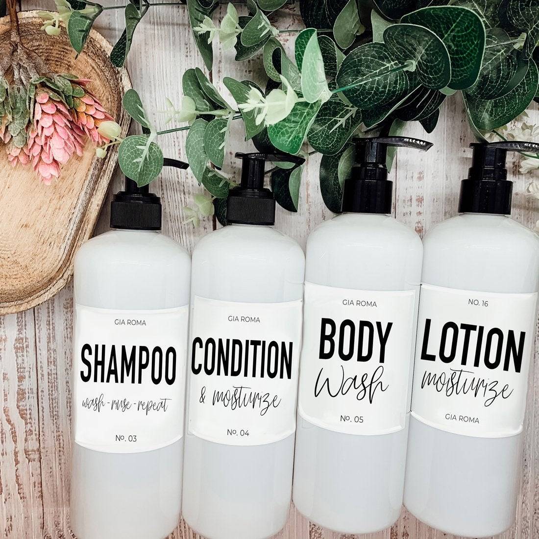 Set of 16oz white PET pump bottles labeled shampoo, condition & moisturize, body wash, and lotion. Stylish dispensers with floral and greenery accents.