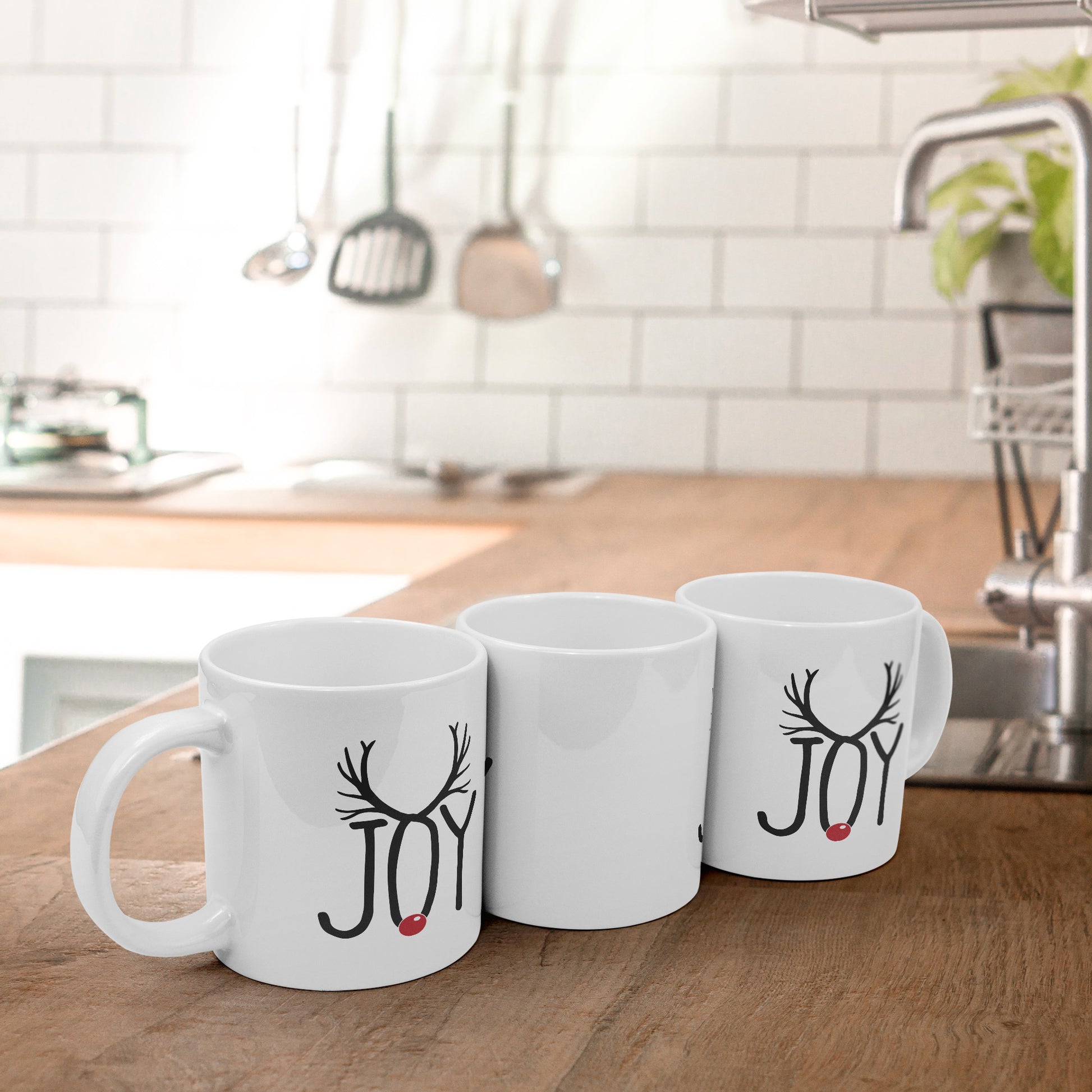 Three Joyful Reindeer Antlers Mugs on wooden counter