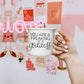 14.5oz ceramic coffee mug with 'You Are a Freaking Goddess' quote, held in front of a pink and red Valentine's Day-themed wall.